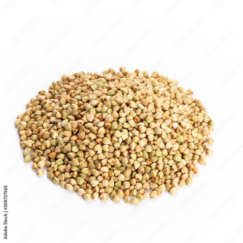 Heap of dried buckwheat seeds isolated on white background.