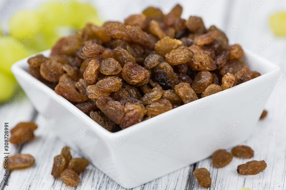 Portion of healthy Raisins (selective focus; close-up shot) Portion of healthy Raisins (selective focus; close-up shot)