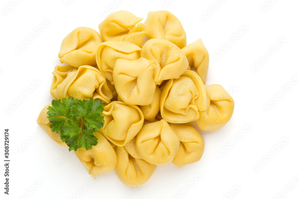 Raw homemade pasta,tortellini with herbs.
