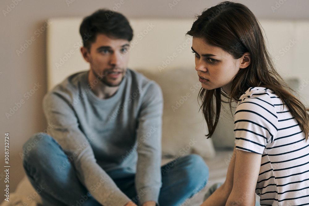 young couple sitting on sofa at home young couple sitting on sofa at home
