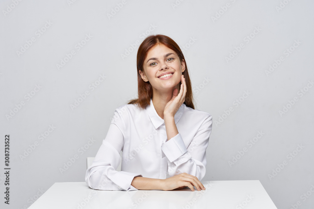 portrait of a businesswoman sitting at her desk portrait of a businesswoman sitting at her desk