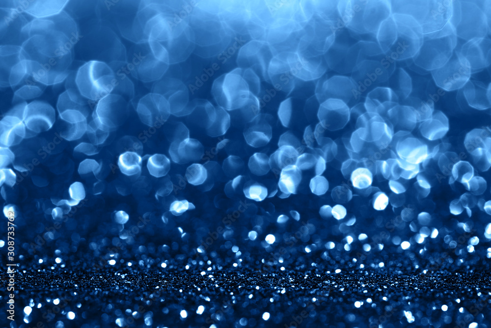Blue sparkling abstract background. Festive concept. Color of the year 2020 concept. Blue sparkling abstract background. Festive concept. Color of the year 2020 concept.