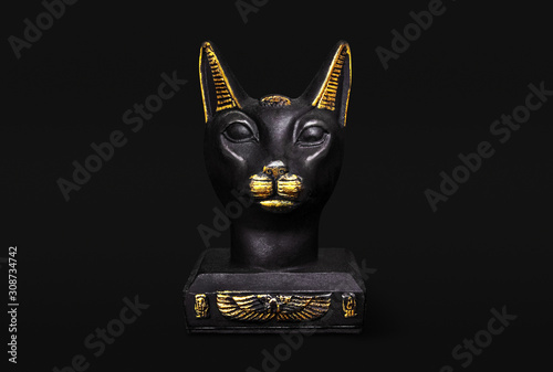 A divine cat from the culture of Ancient Egypt isolated on black background