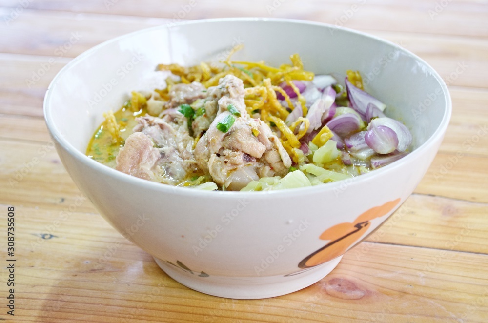 Curry Noodle Soup with Chicken (KhaoSoi Kai), Thai traditional northern style food. Curry Noodle Soup with Chicken (KhaoSoi Kai), Thai traditional northern style food.