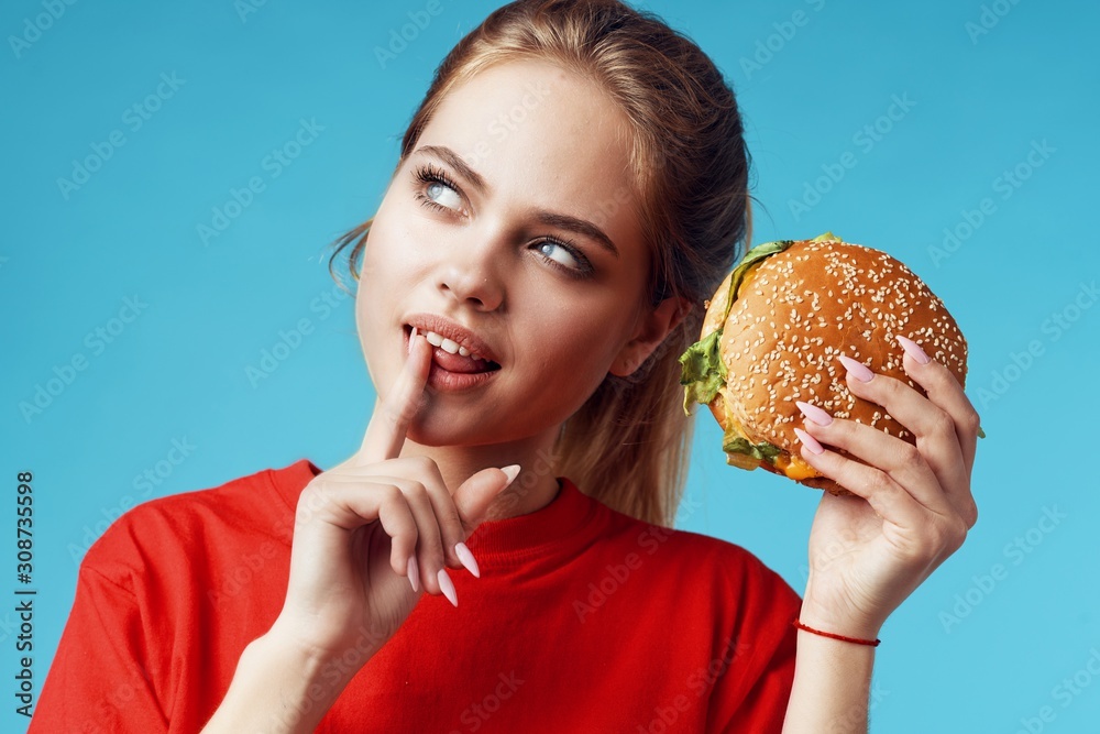 young woman with hamburger