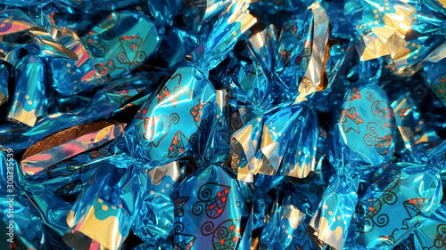 A heap of hungarian christmas sweetness fondant wrapped in various colorful metal papers
