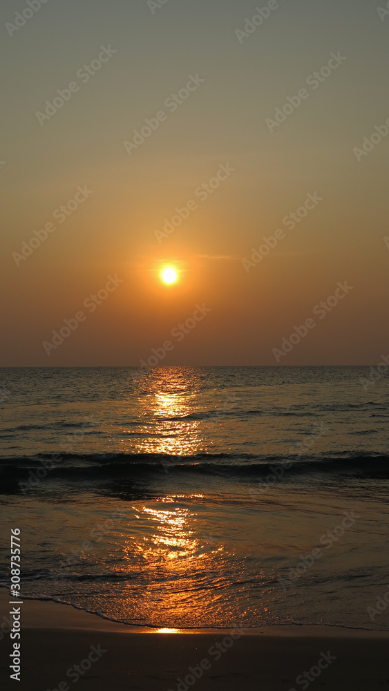 Sunset over with sunlight reflection in the sea