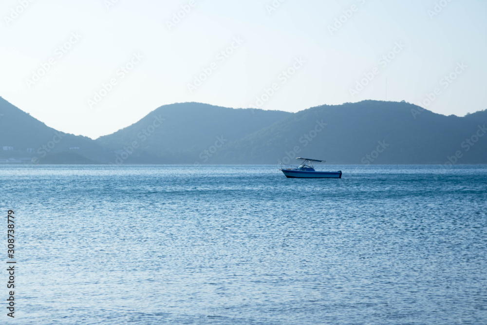 Beautiful landscape, boat running in the middle of the sea