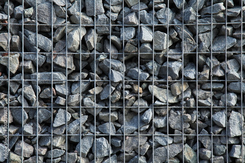 Gabion, texture, background. Gabion net frequent part (design). New technologies in the manufacture of retaining walls and fences. Landscaping. Fencing decorative elements photo