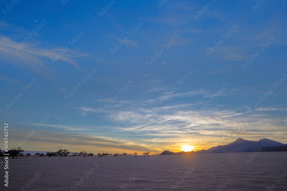 Blue sky at sunrise in the desert