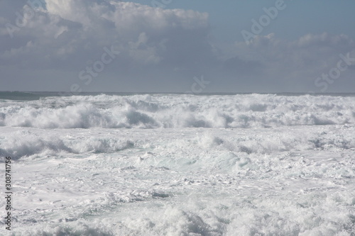 Foam of the sea. storm. white waves and blue background