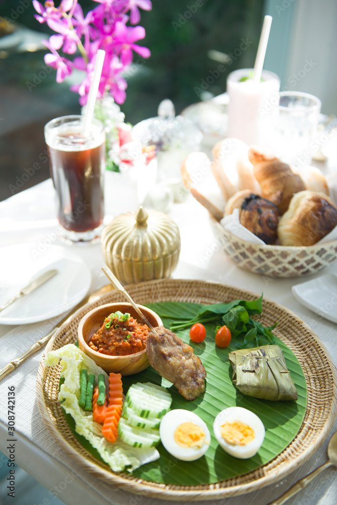 Thai norther style famous food. Grill pock with sticky rice and eggs. Thai norther style famous food. Grill pock with sticky rice and eggs.