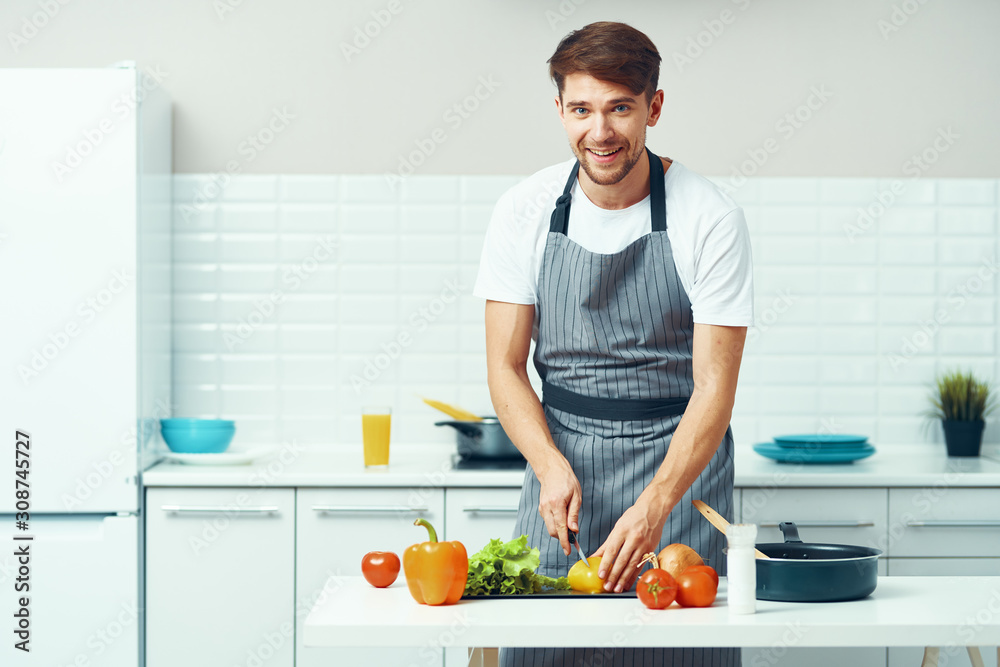man cooking in kitchen man cooking in kitchen