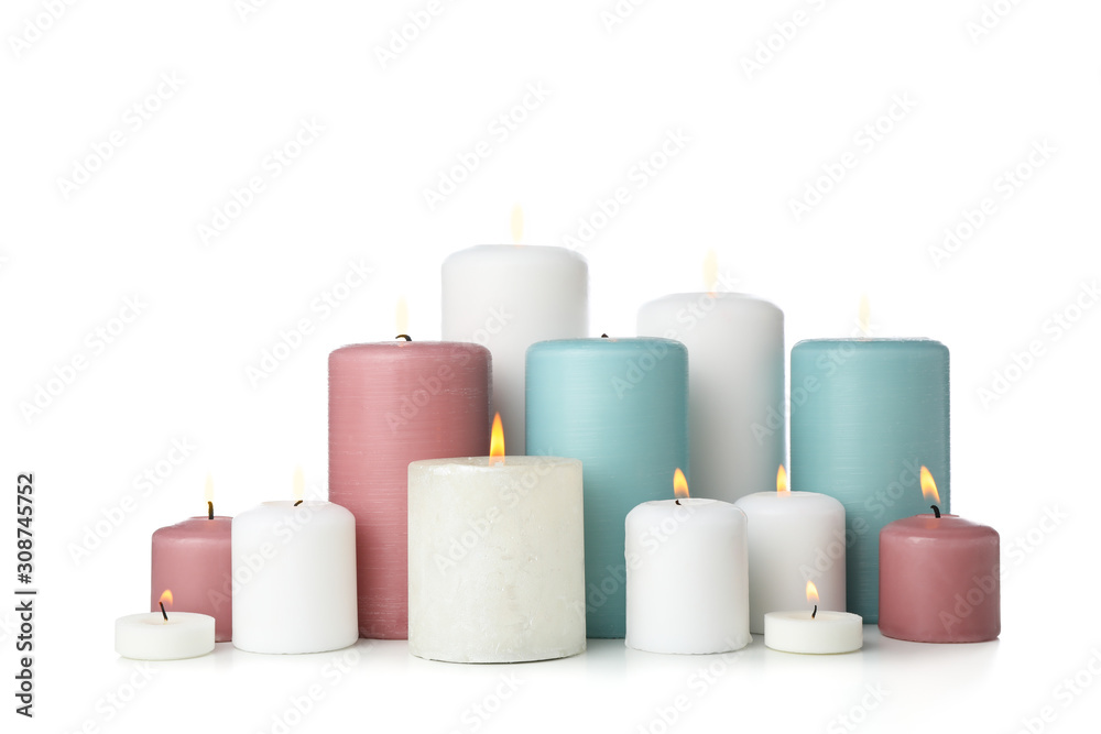 Group of different candles isolated on white background
