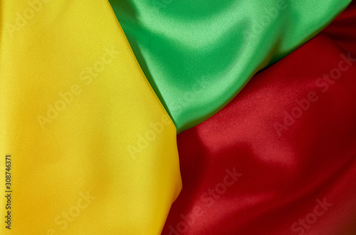 background red  yellow  green satin fabric with pleats