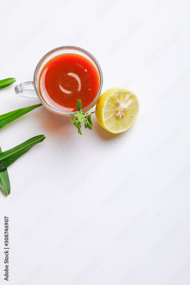Black tea with lemon and ginger over white background Black tea with lemon and ginger over white background