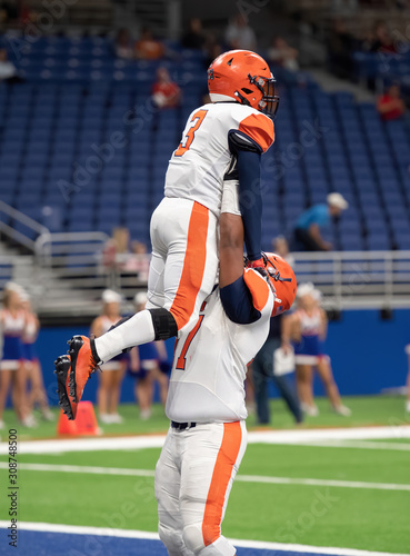 Great action photos of football players making amazing plays during a football game photo