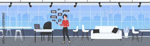 businesswoman using smartphone online chatting app social network speech chat bubble communication concept modern office interior horizontal banner full length vector illustration
