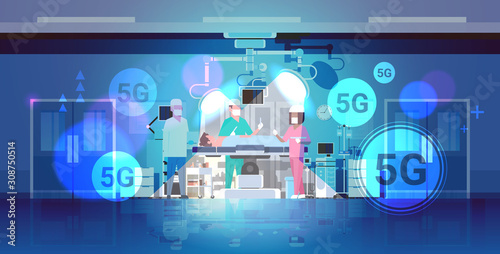 surgeons team surrounding patient lying on operation table 5G online wireless connection concept fifth innovative generation of high speed internet operation room hospital clinic interior horizontal