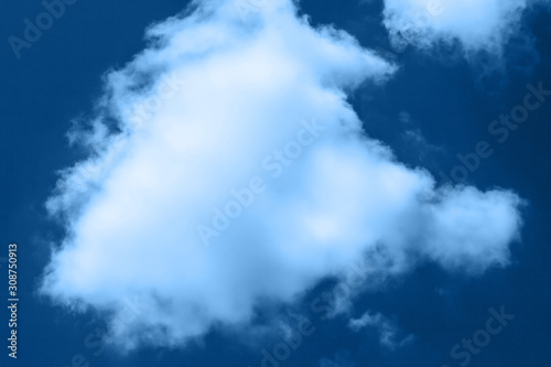 beautiful blue sky with a white clouds in classic blue trendy color. background. Color of the year 2020.