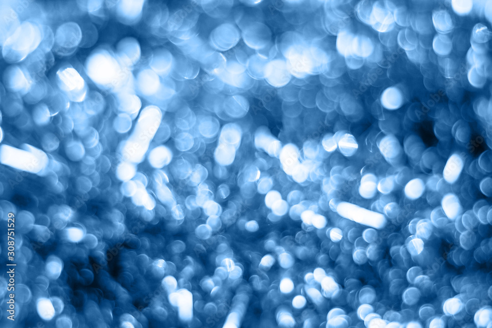 Christmas Festive abstract with bokeh defocused lights in classic blue trendy color. background. Color of the year 2020. Christmas Festive abstract with bokeh defocused lights in classic blue trendy color. background. Color of the year 2020.
