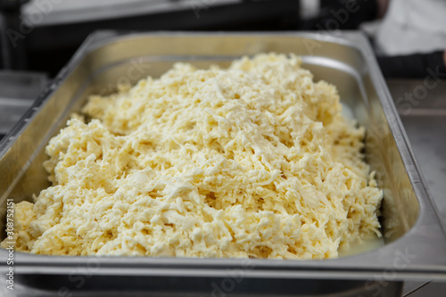 In the cheese factory, during the preparation of the Caciocavallo.