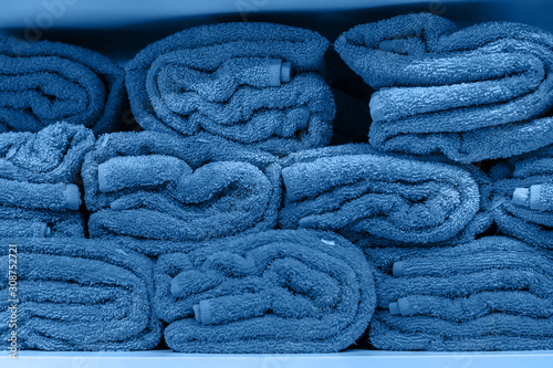 pile of towel arranging in layer in classic blue trendy color. background. Color of the year 2020.