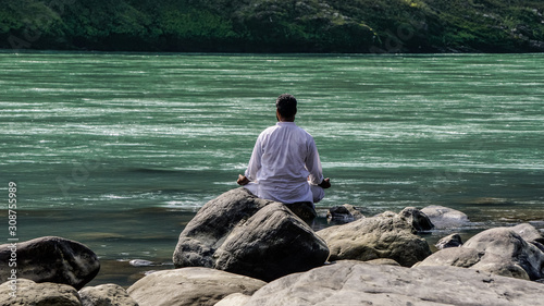 Man meditating near Ganges River