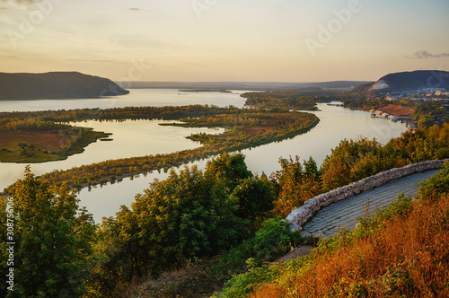 View of the Volga River from an observation platform near Samara, golden sunset over the Zhigulev mountains. photo