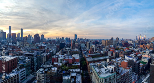 Panoramic New York City skyline view as dusk falls on the buildings of Manhattan