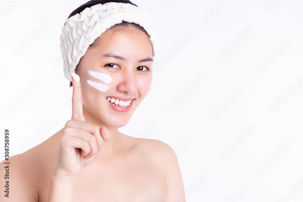 Asian woman apply cream, lotion to beautiful skin on face. Young woman showing cream, moisturizer on face, finger. Smiling Asia beautiful girl get satisfied cream. She has nice skin. Skincare concept Asian woman apply cream, lotion to beautiful skin on face. Young woman showing cream, moisturizer on face, finger. Smiling Asia beautiful girl get satisfied cream. She has nice skin. Skincare concept