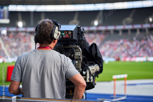 Fototapeta Naklejka Na Ścianę i Meble -  Cameraman at sports event