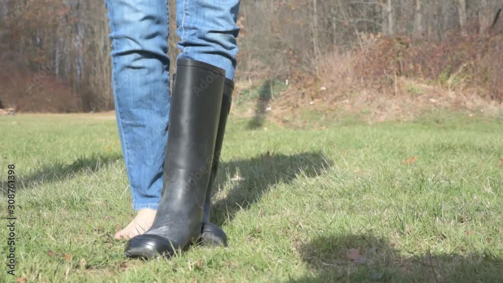Woman Steps Out of Boots and Walks through Grass 60fps Woman Steps Out of Boots and Walks through Grass 60fps