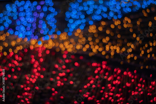 Bokeh blur of lights for decorating Christmas trees at Christmas and New Year's every year. As a light background