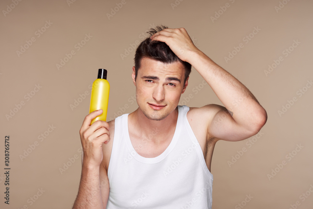 portrait of young man with glass of orange juice portrait of young man with glass of orange juice