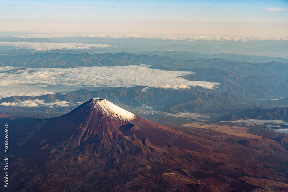 A birds eye view close-up the Mount Fuji ( Mt. Fuji ) and blue sky. Scenery landscapes of the Fuji-Hakone-Izu National Park. Shizuoka Prefecture, Japan