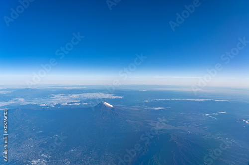A birds eye view close-up the Mount Fuji   Mt. Fuji   and blue sky. Scenery landscapes of the Fuji-Hakone-Izu National Park. Shizuoka Prefecture  Japan
