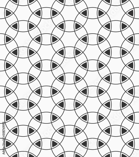 Vector seamless pattern of overlapping circles nad triangles.