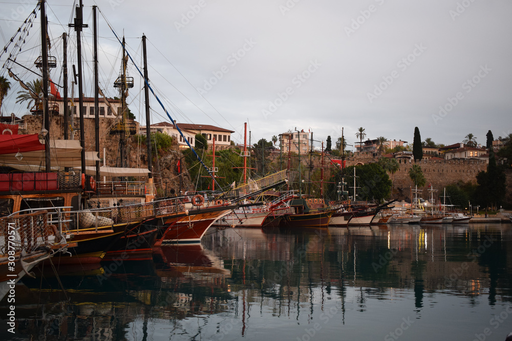 Ships and boats in the harbor in the old port of Antalya in Turkey