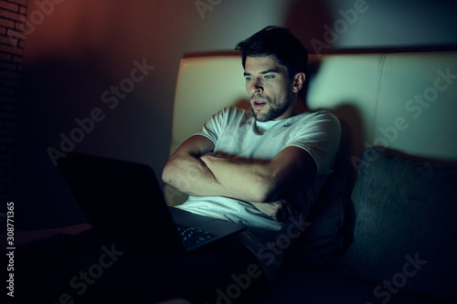 young man sitting on sofa