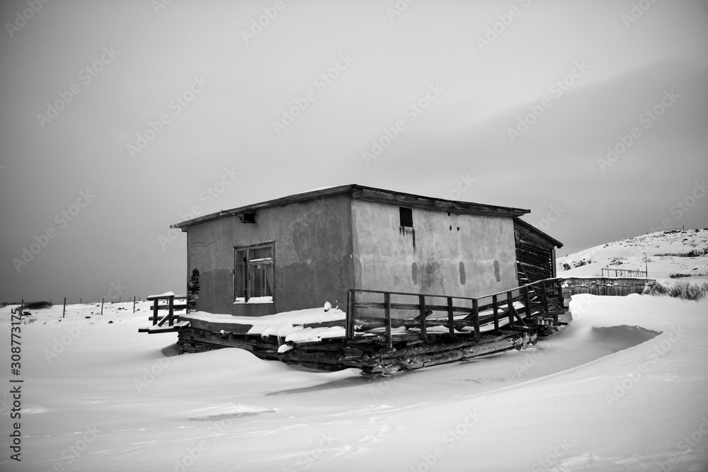 old houses under snow in the Russian Arctic old houses under snow in the Russian Arctic