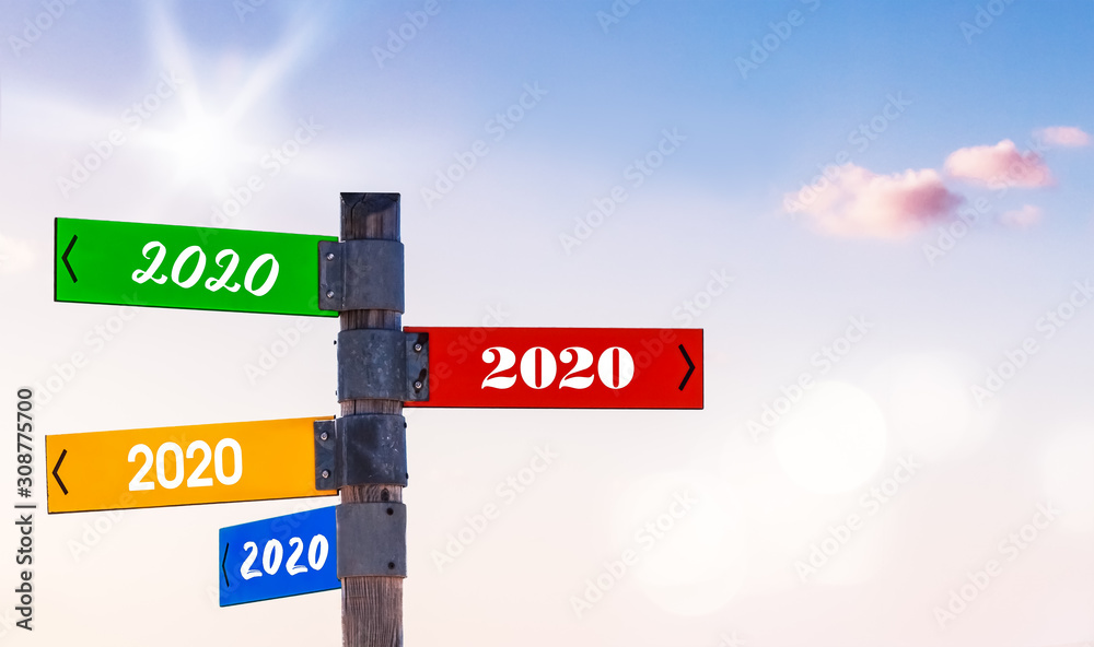 Fototapeta premium Signpost with 2020-Arrows in Different Colors