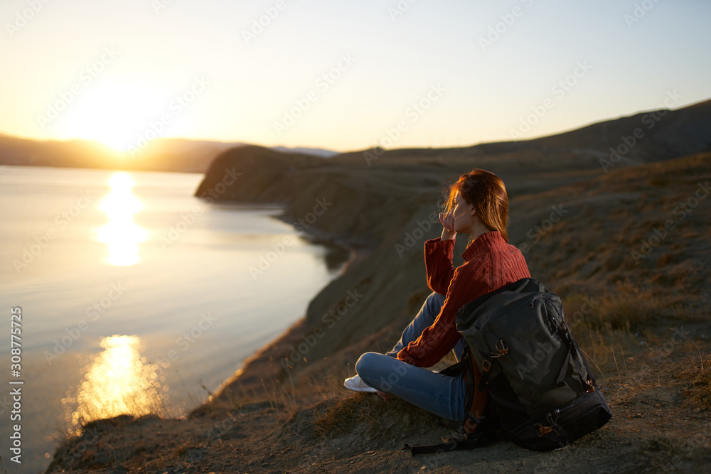 woman sitting on top of mountain woman sitting on top of mountain