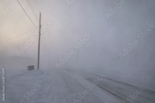 Road disappearing under blizzard conditions in Arviat, Nunavut Canada in winter conditions 