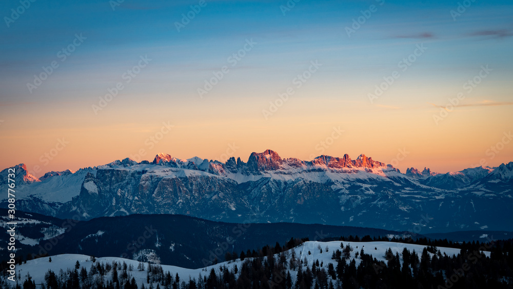 Snowy rocky mountain with a beautiful pink sunset, space fort text Snowy rocky mountain with a beautiful pink sunset, space fort text