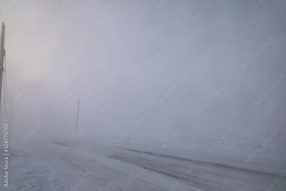 Road disappearing under blizzard conditions in Arviat, Nunavut Canada in winter conditions Road disappearing under blizzard conditions in Arviat, Nunavut Canada in winter conditions