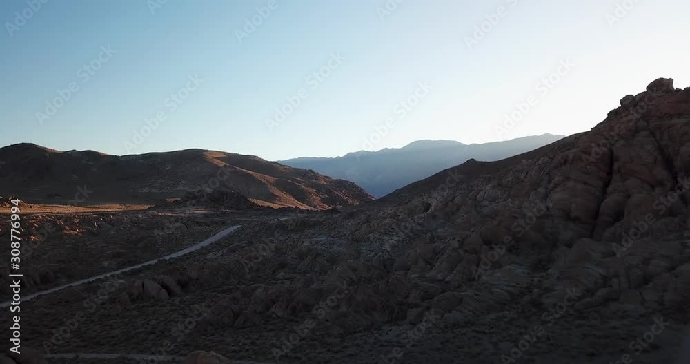 Aerial Sunrise Landscape View and Desert Road in Valley of Alabama Hills, California USA Aerial Sunrise Landscape View and Desert Road in Valley of Alabama Hills, California USA
