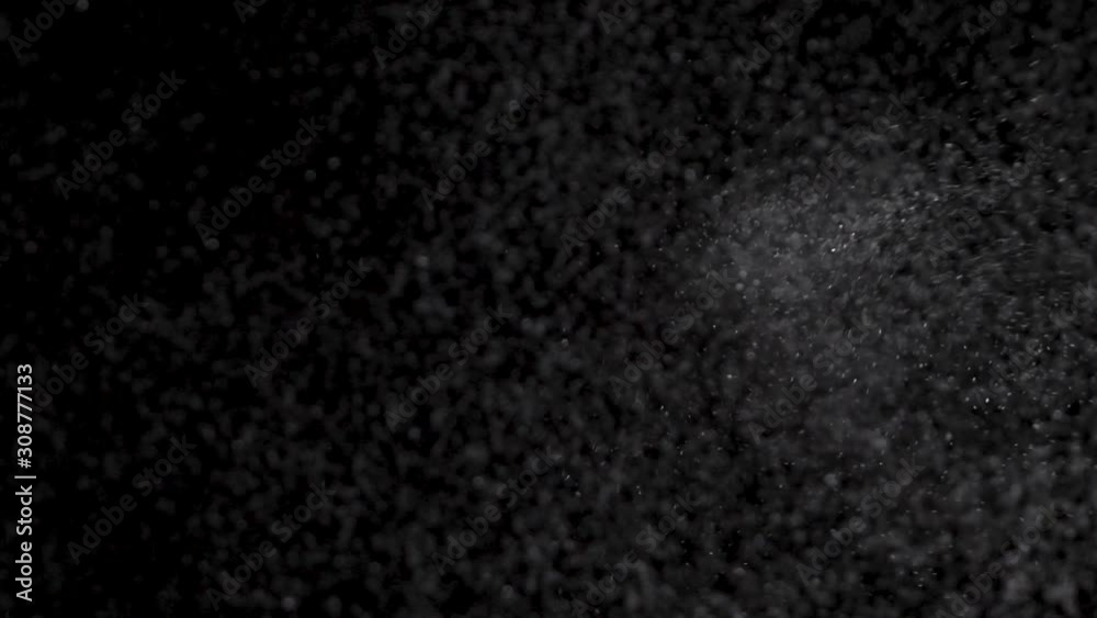 Epic drop sprinkling of silver glitter salt on glass, pov shot Epic drop sprinkling of silver glitter salt on glass, pov shot