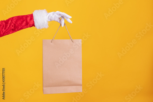 santa claus hand with shopping bags
