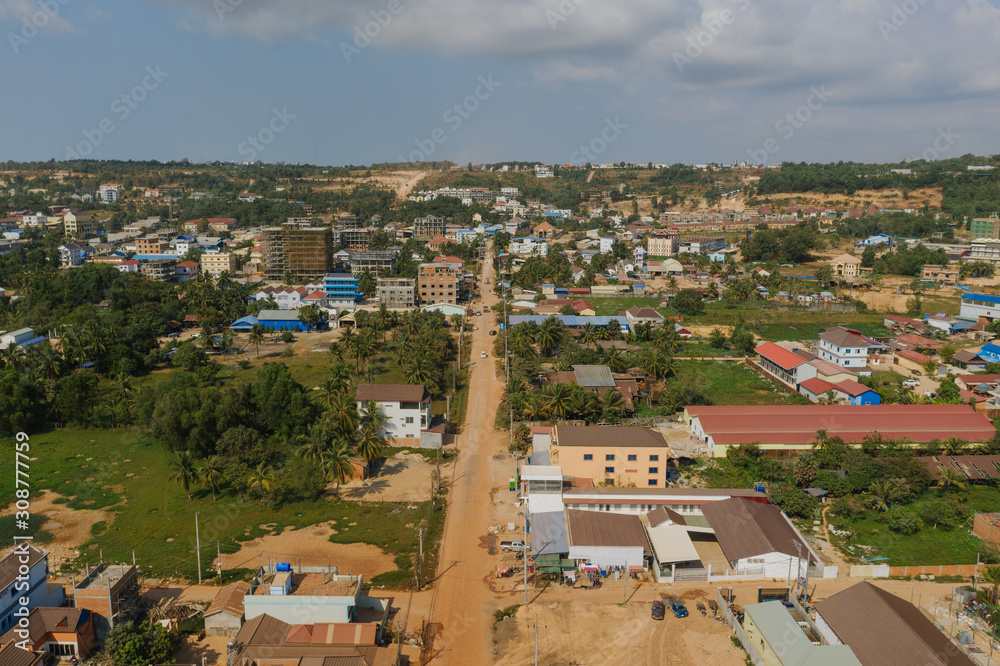 Cars traffic in Sihaoukville city streets, Drone shot